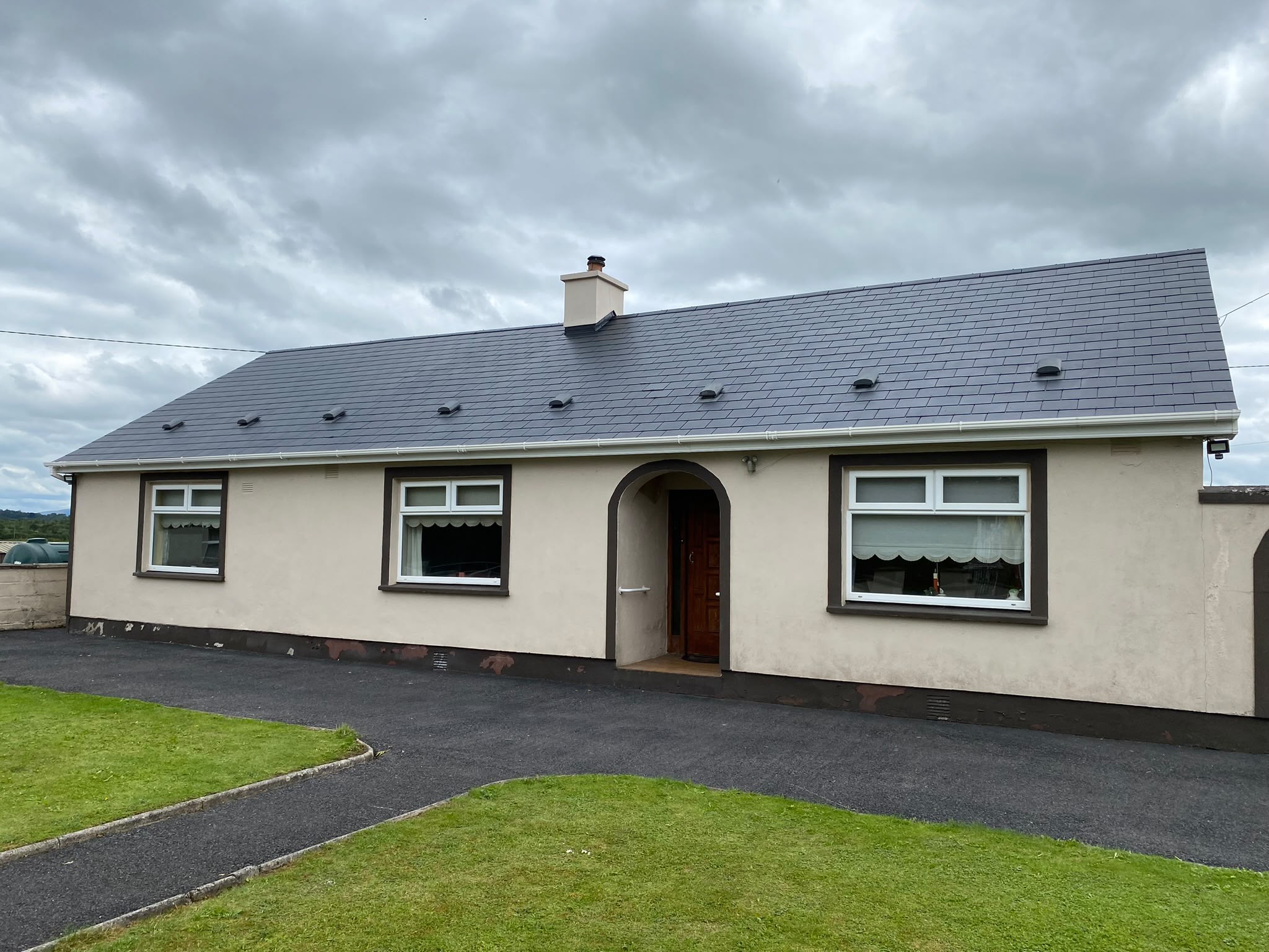 Bungalow with a freshly re-coated roof by Brian Kelly Services