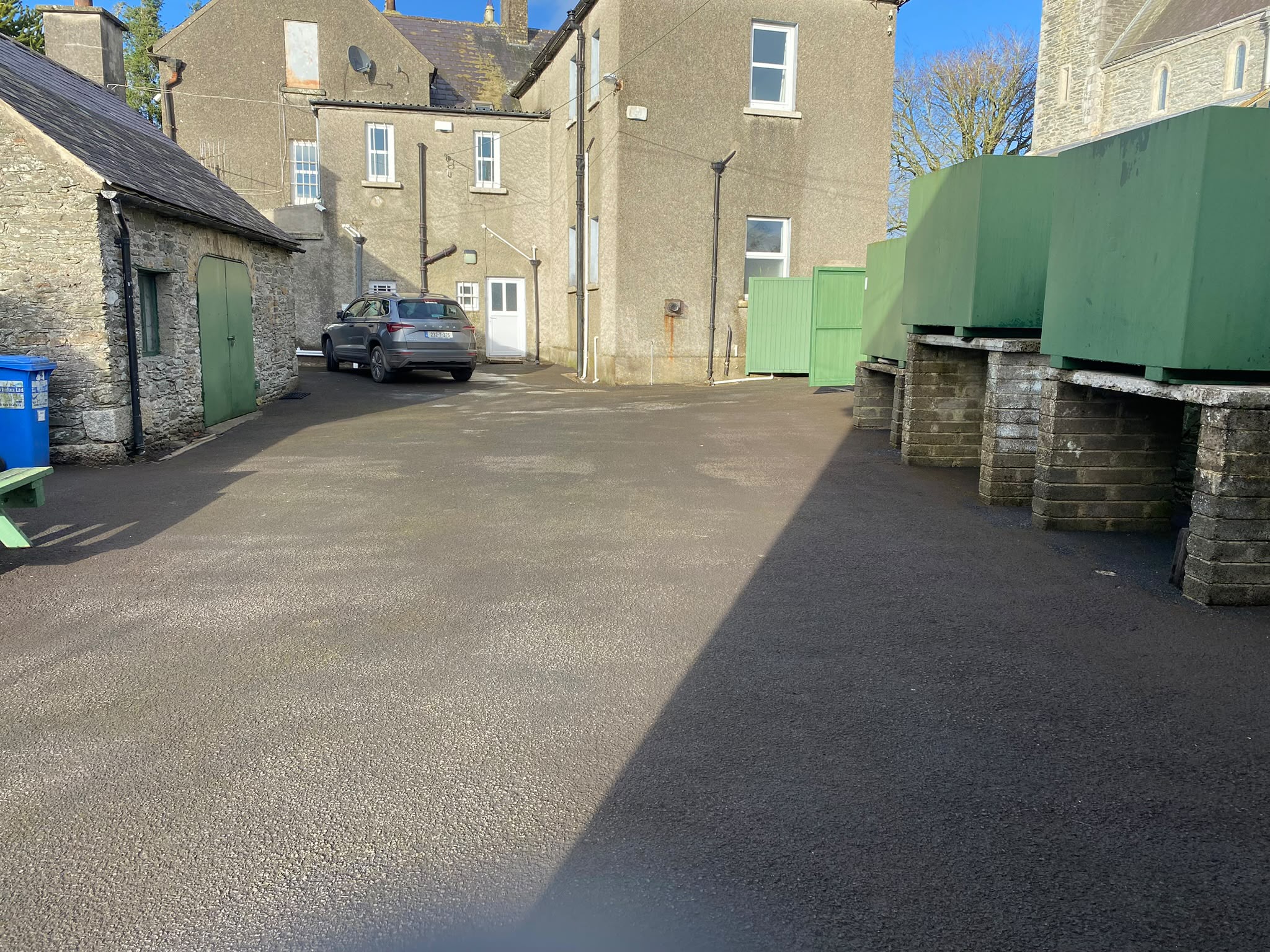 Tarmac yard cleared of moss and algae by Brian Kelly Services