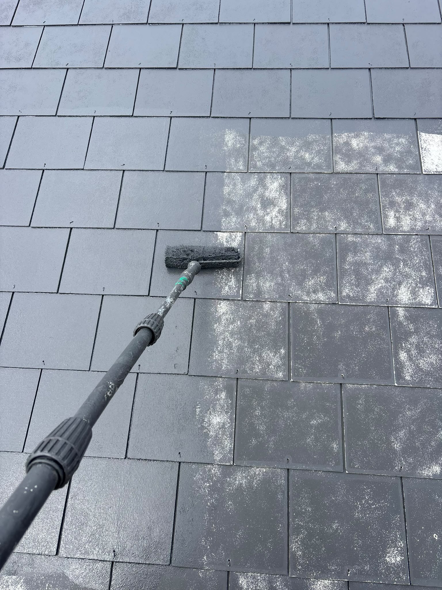 Softwash treatment being applied to a slate roof
